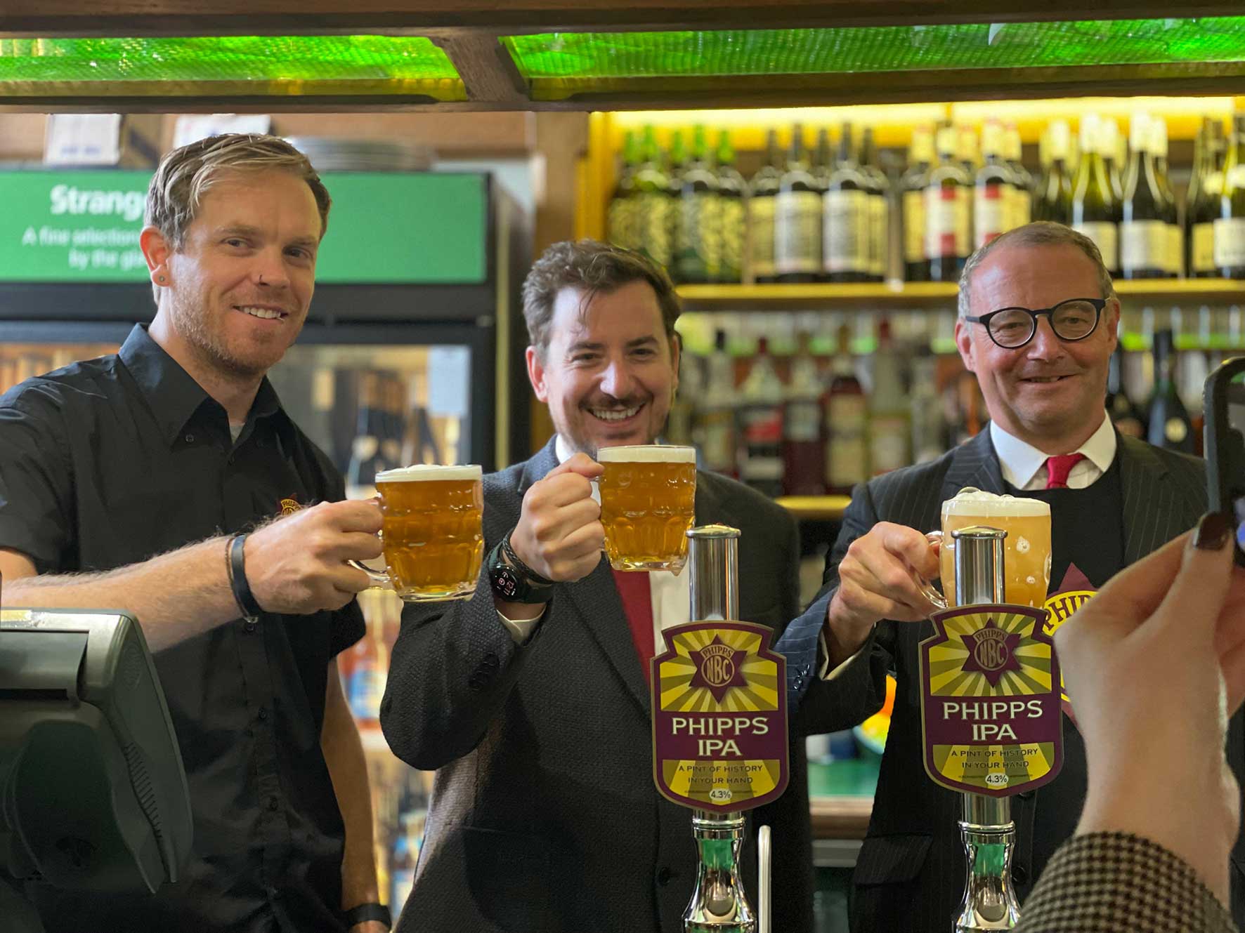 Mike Reader with owners of Phipps Brewery say cheers