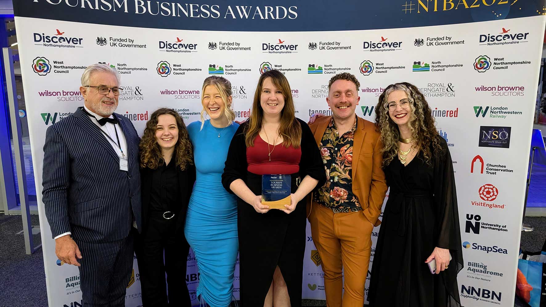 Delapré Abbey team celebrating Large Visitor Attraction win at Northamptonshire Tourism Awards 2025