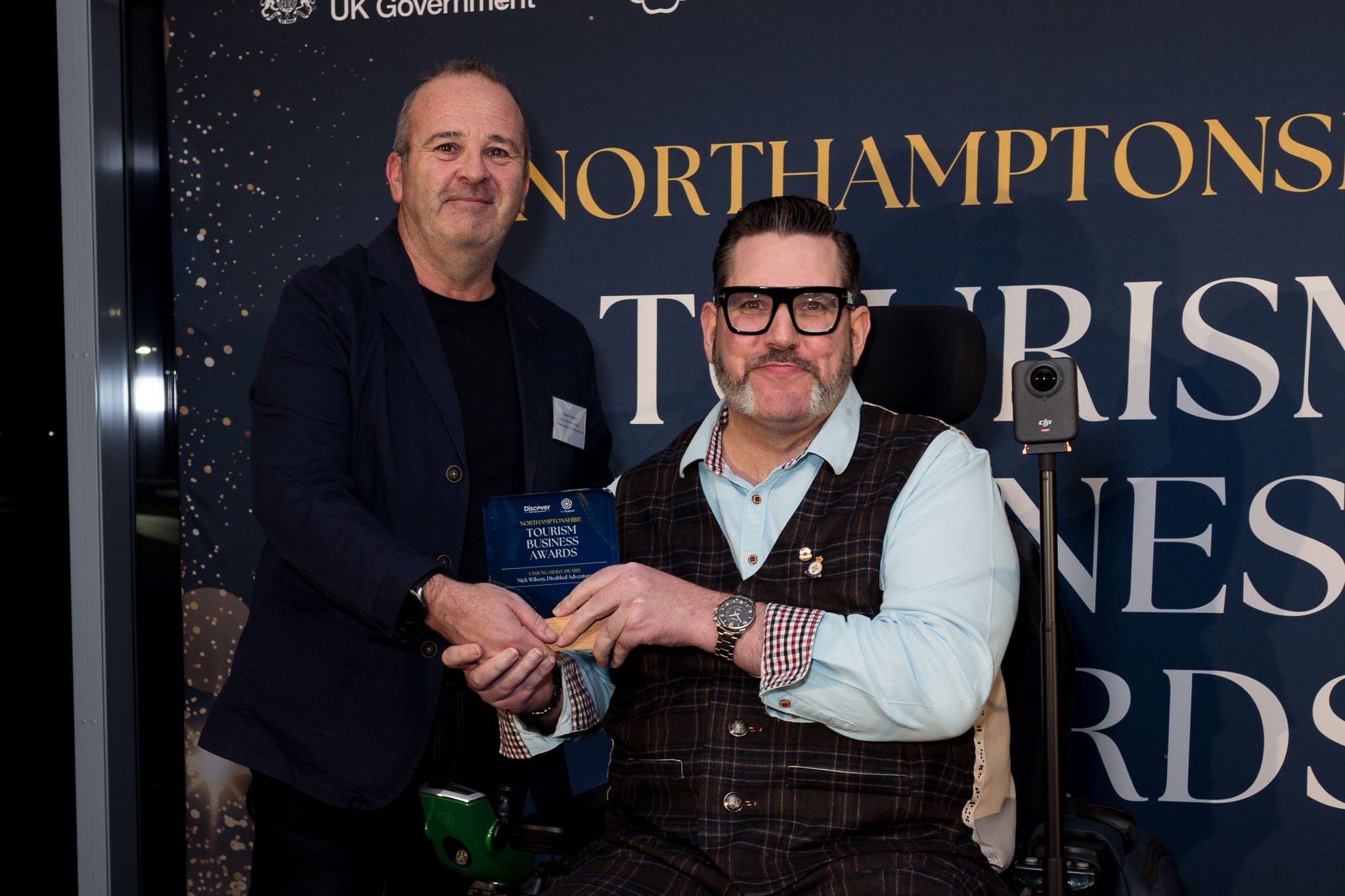 Wayne Jenkins of Wilson Browne Solicitors presenting the Unsung Hero Award to Nick Wilson at the Northamptonshire Tourism Business Awards at Silverstone Museum.