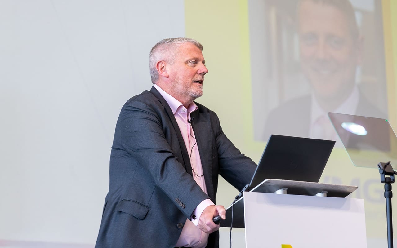 Andrew Kinniburgh, director general of Make UK Defence, speaking at the Silverstone Technology Cluster Innovation & Growth Conference at the University of Warwick.