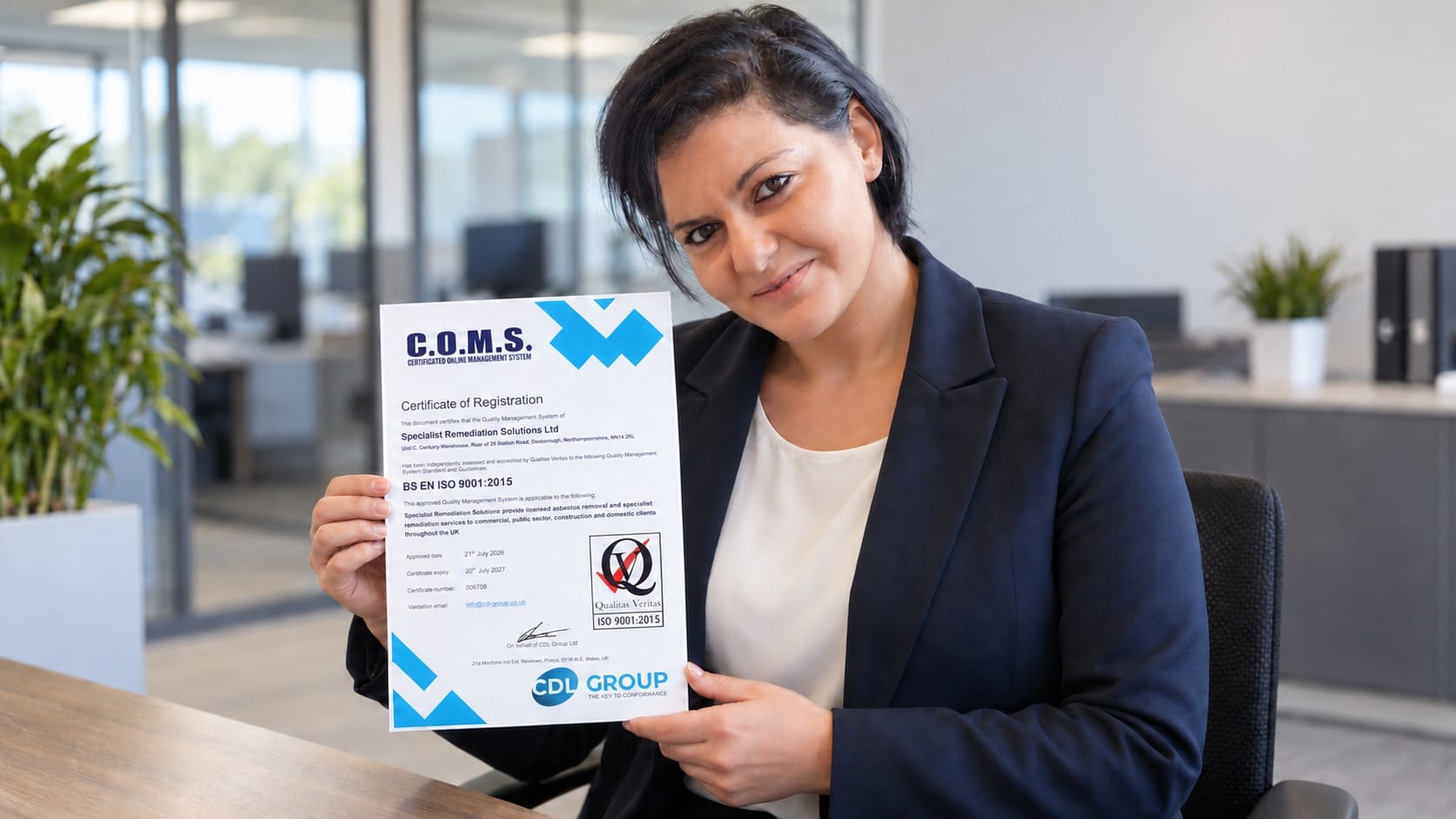 Elena Paunete of Specialist Remediation Solutions holding the company’s ISO 9001 certification