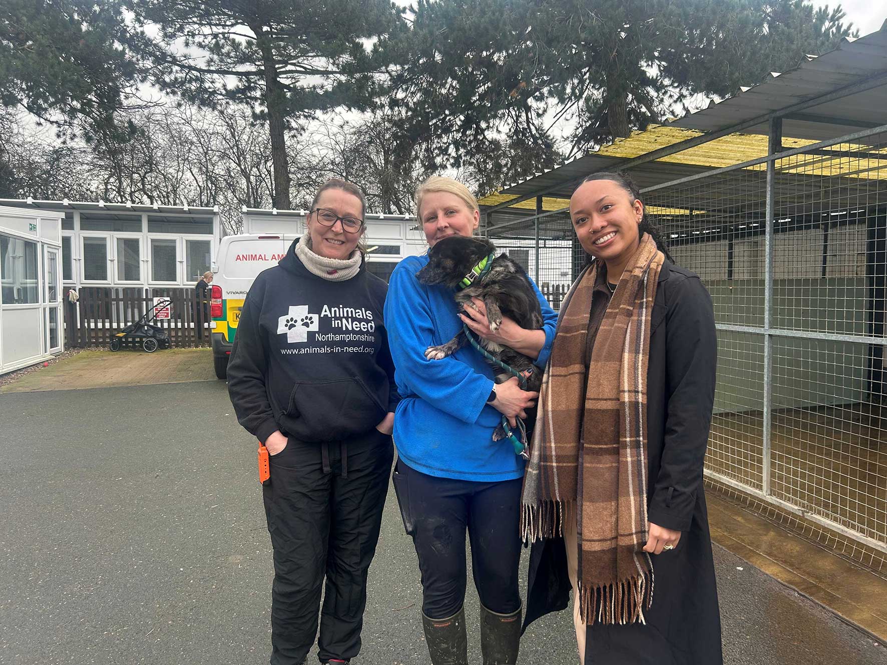 Three women with a rescued dog at Animals in Need in Northamptonshire, the charity benefiting from Commsave Credit Union's fundraising quiz night.